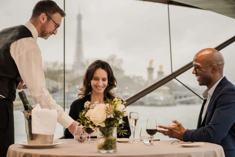 Paris: 4-Course Dinner Cruise on Seine River with Live Music - Onboard setup: bay windows, upper deck views, and a smooth start