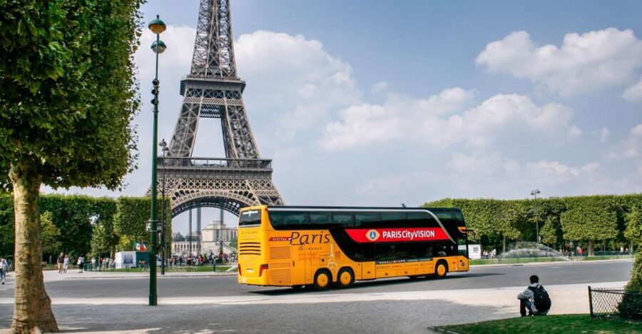 Paris: Audio-Guided Bus Tour & Seine River Cruise - Inside the luxury coach: host narration plus tablet-style visuals