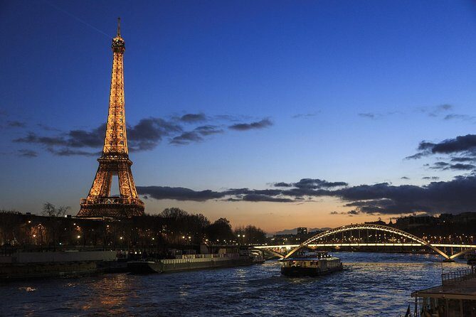 Paris By Night with Seine River Cruise and Roundtrip Luxury Transportation - The Eiffel Tower Stop: Quick Views, Big Impact
