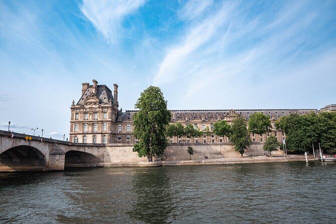 River Seine Sightseeing Boat Tour with Audio Guide - Notre-Dame and the Louvre from the river: iconic sights with less effort