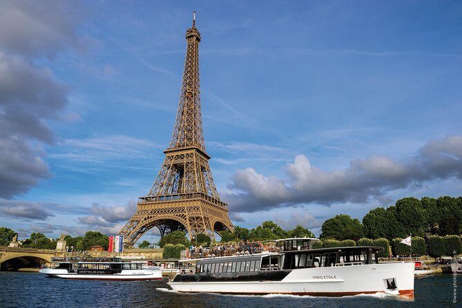 Seine River Guided Cruise by Vedettes de Paris - Electric boat comfort: inside seats, outdoor views, and blankets